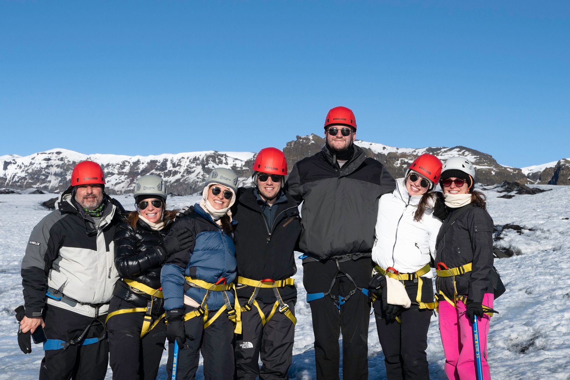 Happy family on Sólheimajökull during a glacier hike
