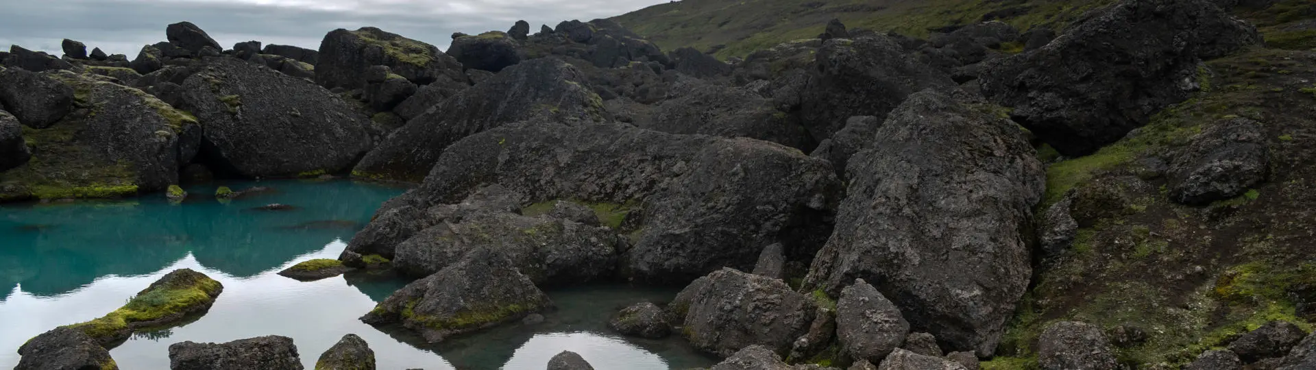 Picture of huge boulders and dark blue waters