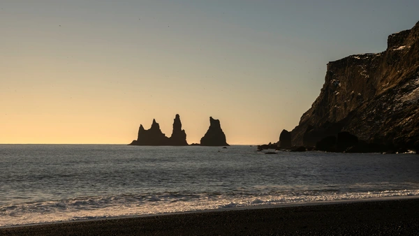 The most famous sea pillars of the south coast of Iceland: Reynisdrangar photographed before sunset