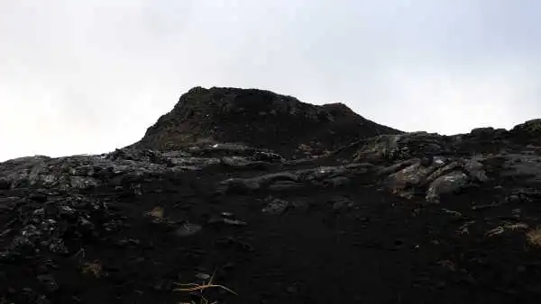 A big, imposing, black, volcanic crater