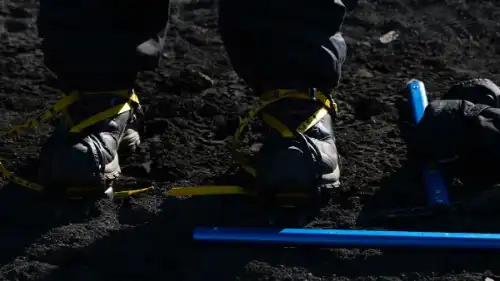 Close up on a fitted pair of mountaineering crampons