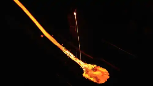 Some molten lava in flowing inside of a building, in a controlled environment