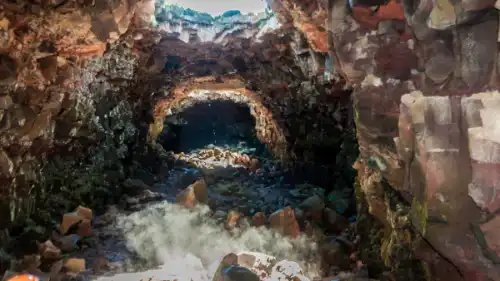 Deep lava tunnel with a skylight at the entrance