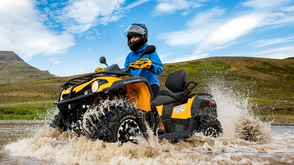 Professional ATV guide explaining safety procedures to tour participants