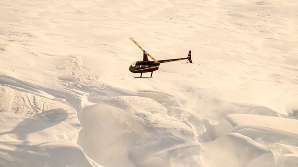 Aerial view of Iceland's vast glacier landscape from helicopter