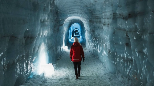 Inside Langjökull Glacier ice cave with blue crystal formations