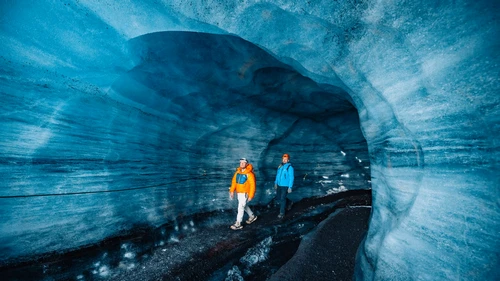 Katla ice cave interior showing volcanic ash layers in ice formations