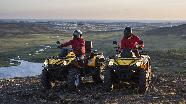 Group of adventurers enjoying extended ATV exploration in Icelandic highlands