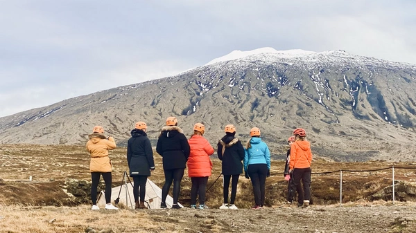 Group of people exploring a old lava cave