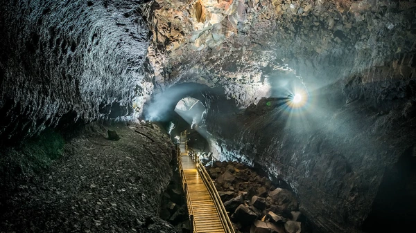 Family group enjoying guided geological education in Viðgelmir lava tube