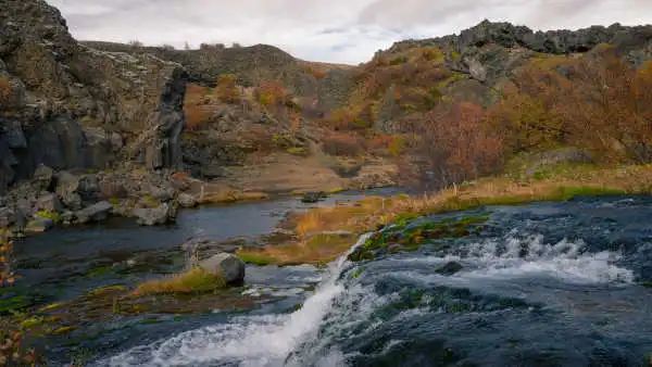 In Autumn, a torrent of water trickles down