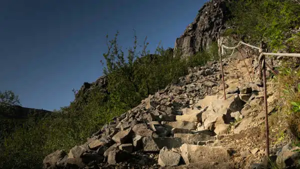 Some stone stairs of a hiking path are going up