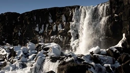 Waterfall of Öxarárfoss partly frozen in the wintertime in Þingvellir