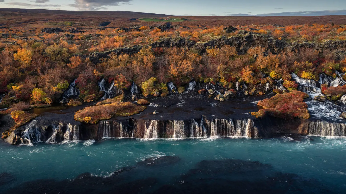 Countless waterfalls falling through bushes in turquoise blue water