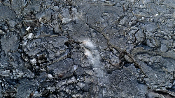 Steaming black rock following volcanic eruptions in Iceland