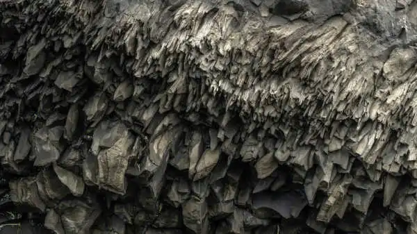 Vey sharp and unique rock formations shaping the ceiling of a cave