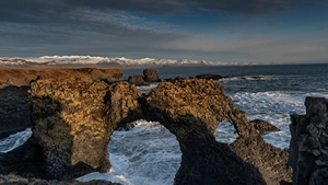 The most famous stone arch of Iceland: Gatklettur in Arnarstapi photographed at sunset