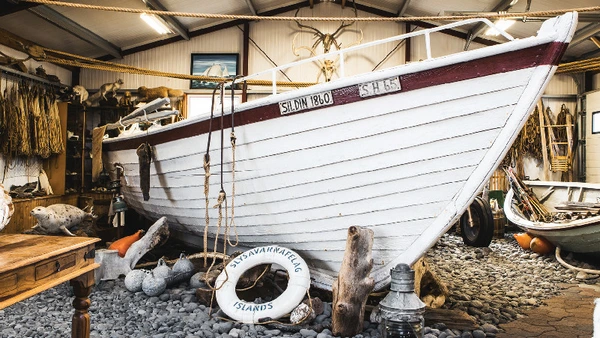 A boat inside of the shark museum