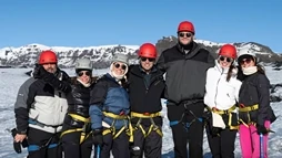 Happy family on Sólheimajökull during a glacier hike