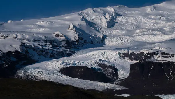 Two glacier outlets are joining as they go down the mountain to form a heart