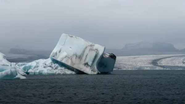 An oddly square-shaped iceberg floating on water