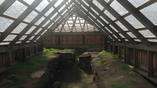 Old ruins or a viking long house, covered by a modern roof