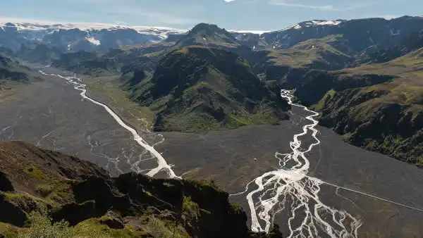 panorama over glaciers, green mountains and braided rivers