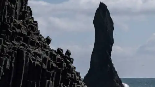 A sea stack over an agitated ocean